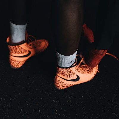 Athletic shoes on dark floor